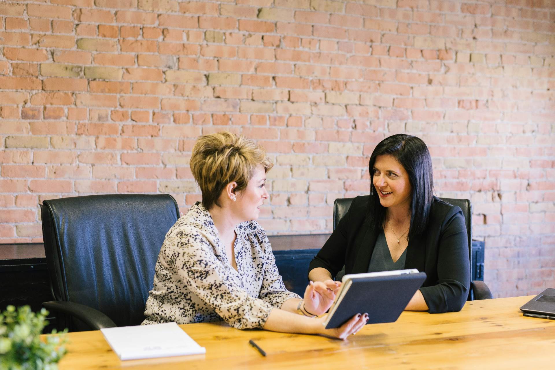 2 professional women discussing together