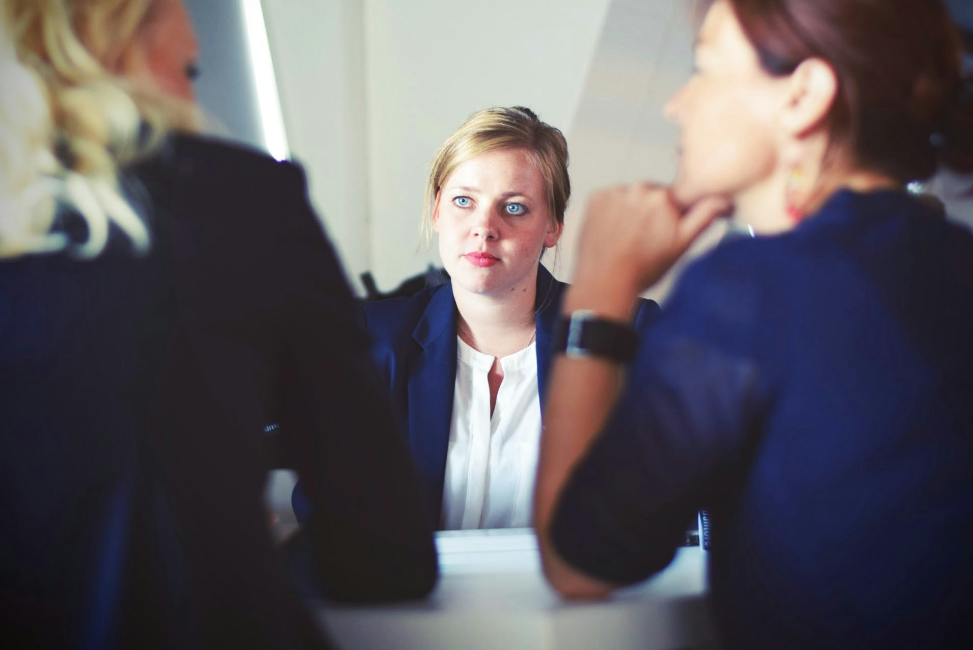 3 professional women discussing together