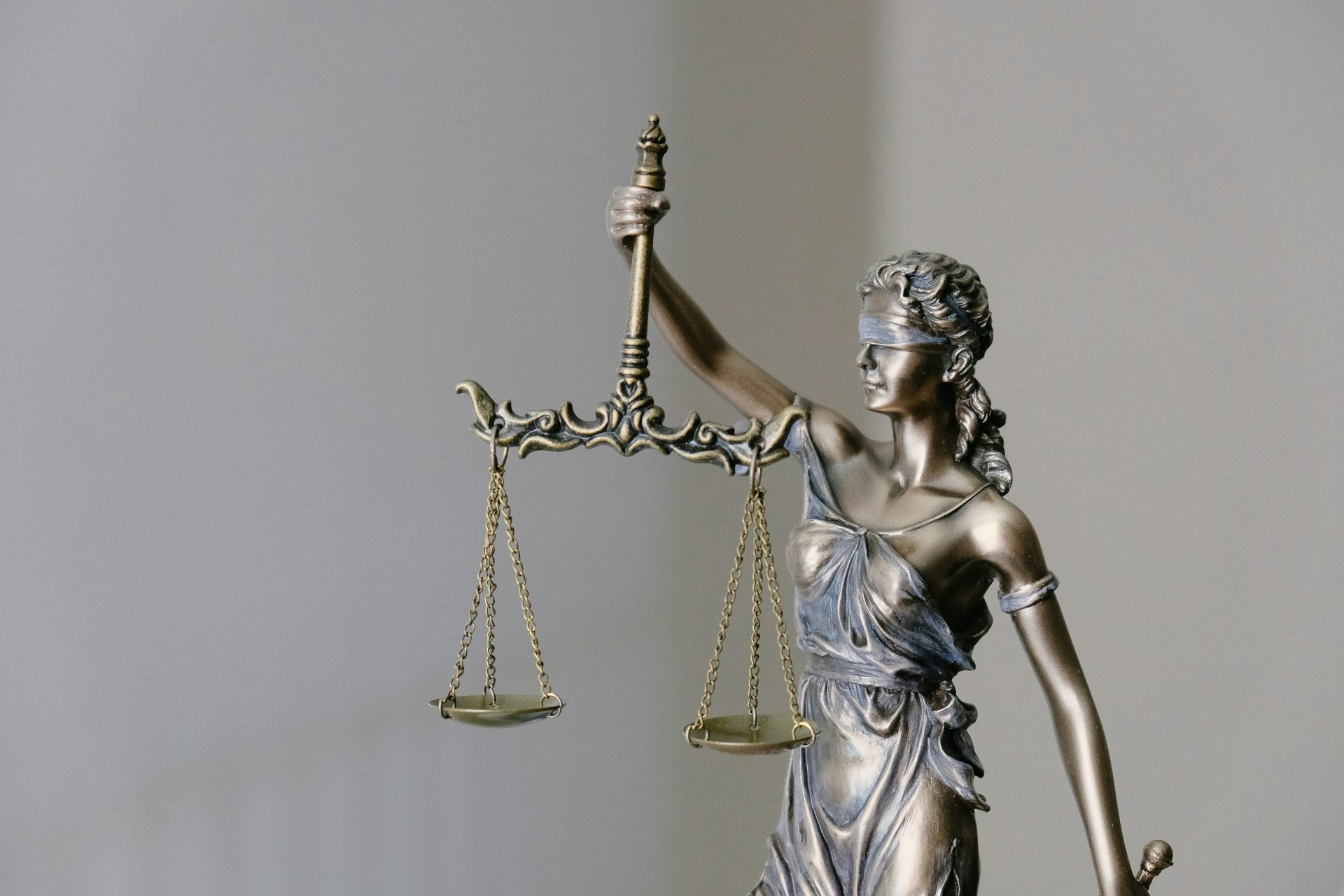 Lady Justice holding scales, symbol of fairness.